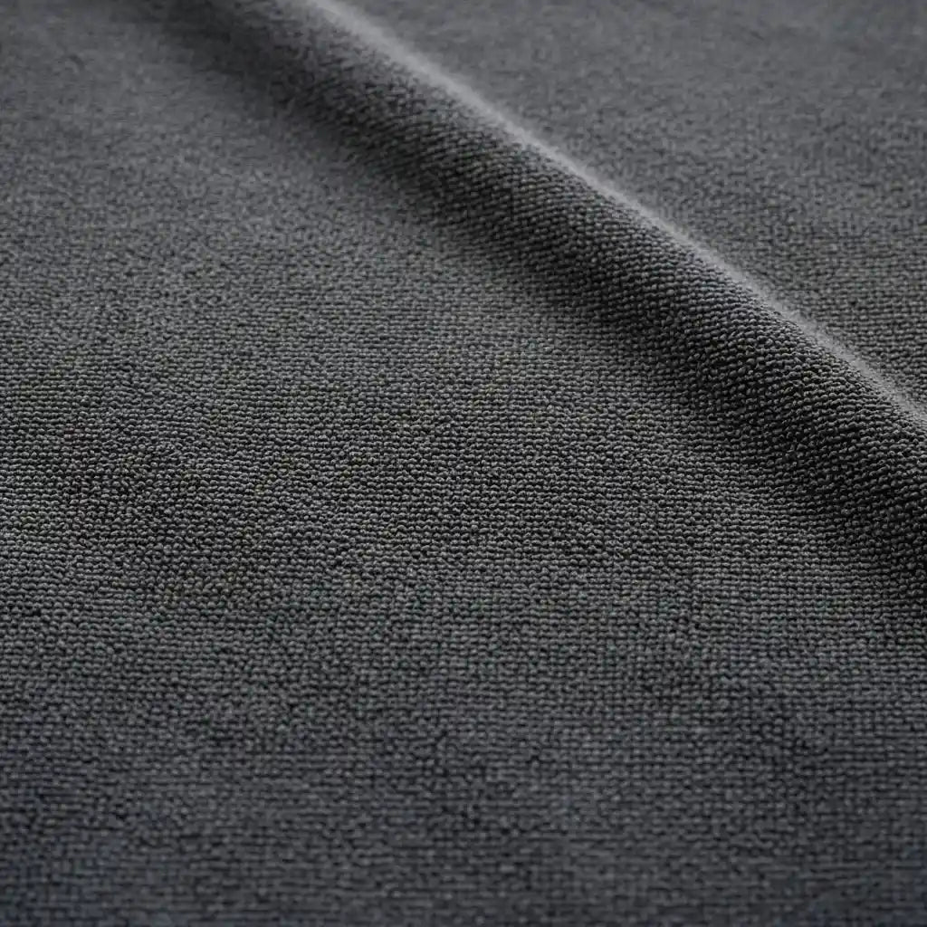 Close-up of dark gray fabric with a subtle texture