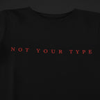 Black t-shirt with red text 'NOT YOUR TYPE' on a black background