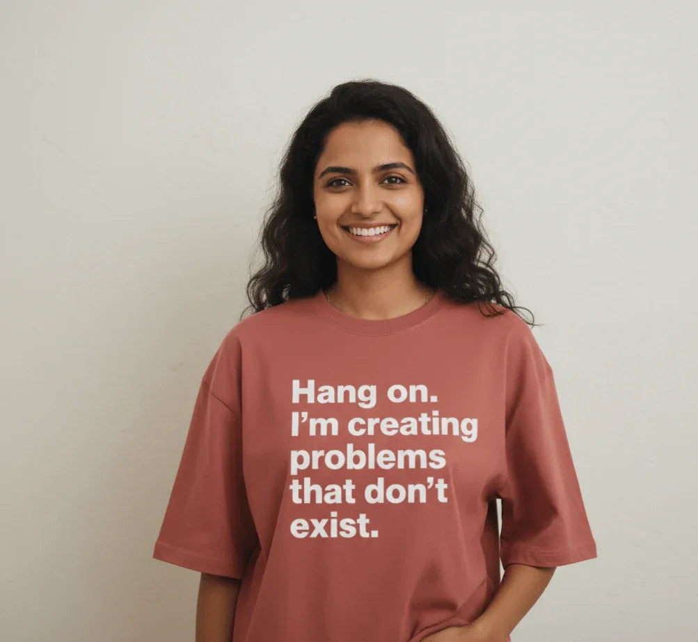 Person wearing a red t-shirt with text on a plain background