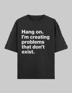 Black t-shirt with white text on a dark background