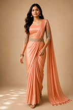 Peach Satin Party Wear Saree with Aari Work Net Blouse & Hip Belt - Front View | Women Fashion India